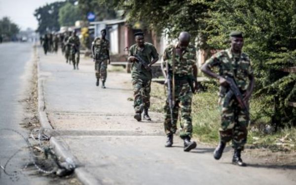 This file photo taken in July 2015 shows Burundian soldiers withdrawing from the restive Cibitoke neighbourhood in Bujumbura.