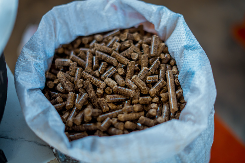 The stoves use pellets, a type of cooking fuel that is 50% cheaper than charcoal.