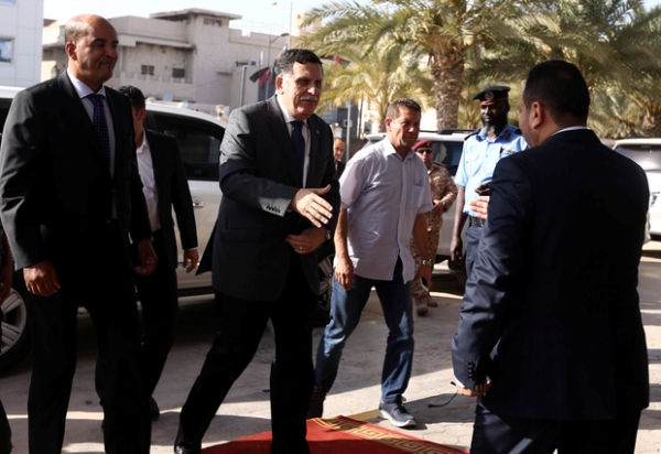 Libya's UN-backed Prime Minister Fayez al-Sarraj (2nd left) arrives for meeting of his Government of National Accord
