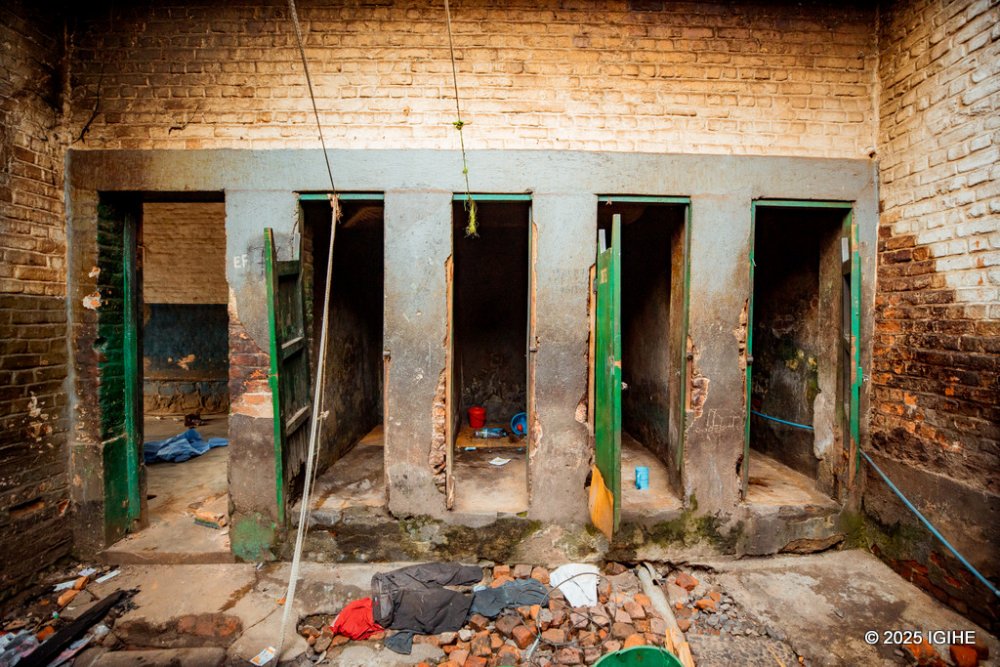 The floors are covered in layers of grime and dirt, with cracks running through the concrete, and some parts uneven and worn down.