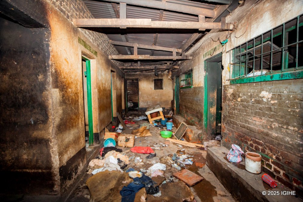 The floors are covered in layers of grime and dirt, with cracks running through the concrete.
