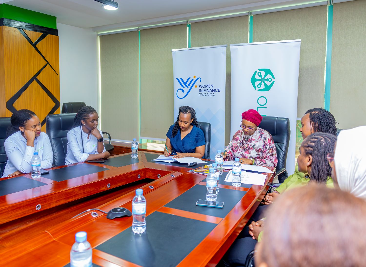 Annie Nibishaka, Managing Director of Old Mutual Insurance Rwanda, and Betty Sayinzoga, Co-founder of WIFR and Group HR Executive for Sanlam Allianz, sign the WIFR Gender Charter.