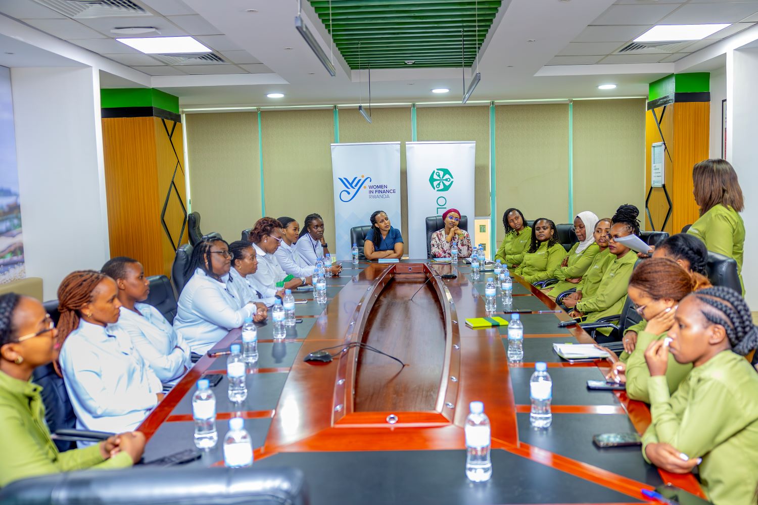 Annie Nibishaka, Managing Director of Old Mutual Insurance Rwanda, and Betty Sayinzoga, Co-founder of WIFR and Group HR Executive for Sanlam Allianz, alongside members of the management team and staff at the event.