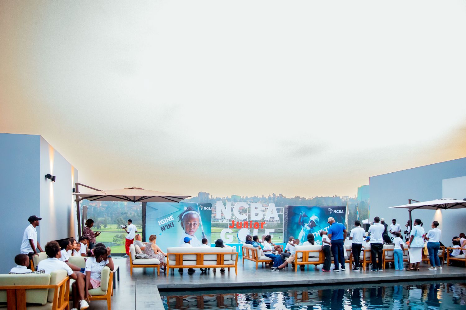 A poolside prize-giving ceremony featured grand trophies, giveaways, and a cake-cutting ceremony, with music, swimming, food, and ice cream courtesy of the sponsors. Families, golfers, and guests celebrated not only a successful tournament but also the bright future of Rwandan golf.