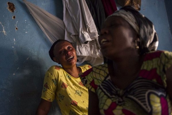 Relatives of a student killed in the Jabe neighbourhood of Bujumbura, mourn at home in the Burundian capital.
