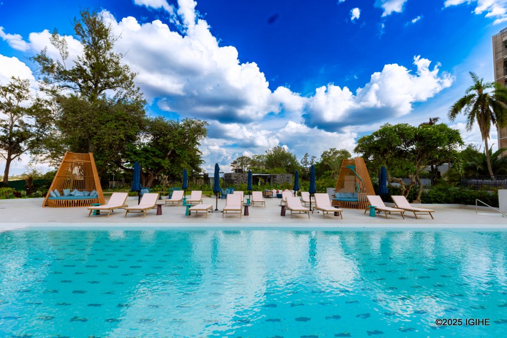 View of the heated outdoor swimming pool at Mövenpick Hotel Kigali.