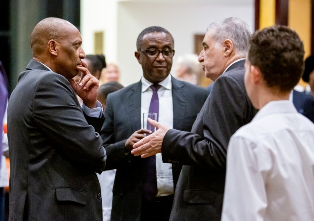 Gen Patrick Nyamvumba chatting with participants of the event including Minister Biruta and Amb. Karen Chalyan.