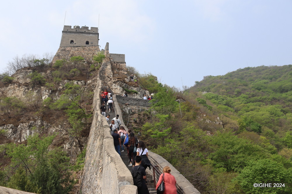 Diverse groups of people are seen ascending the Juyongguan section of the Great Wall.