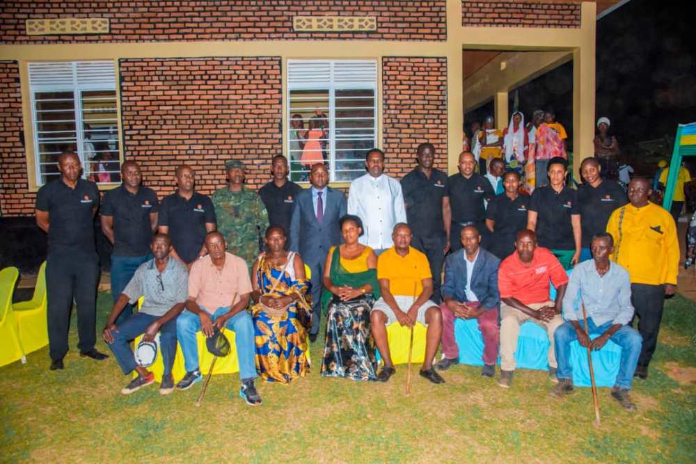 Employees of Serena Hotel, local leaders and beneficiaries in a group photo after handing the cows. 