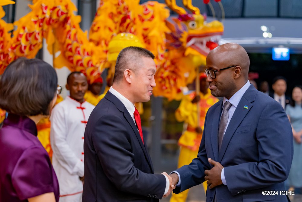 Amb. Wang Xuekun welcoming Minister Nduhungirehe at the celebration of the 75th Annoversary of teh Founding of the People's Republic of China.