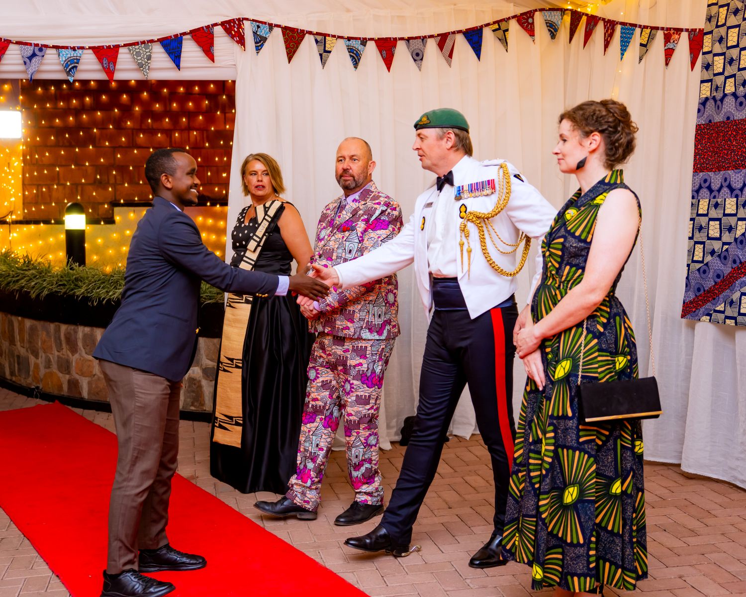 The event brought together members of the diplomatic corps, government officials, cultural figures, and friends of the UK and Rwanda.