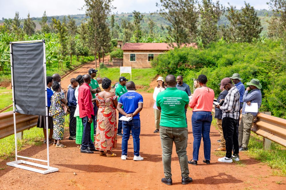 Officials from the World Bank interacting with beneficiaries during the field visit.