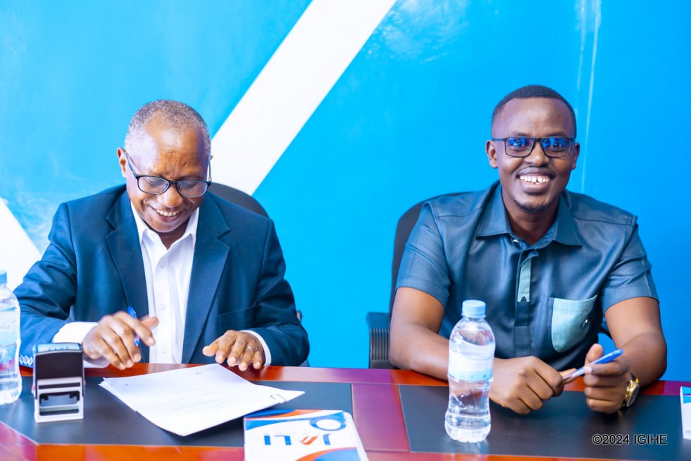 The CEO of Koi Pay, Frank Mugisha (right) with the Chief Operating Officer at Jali Finance, Vedaste Avemariya.