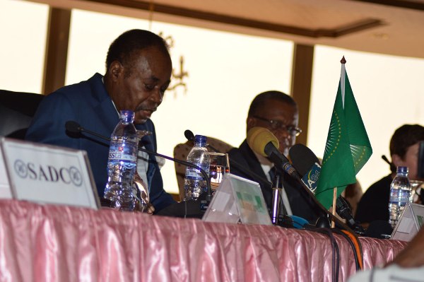 African Union facilitator Edem Kodjo (left) addresses the meeting of the preparatory committee to the national dialogue in the Democratic Repiblic of the Congo (DRC).