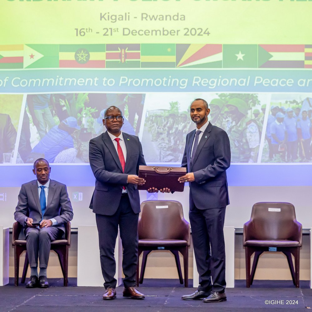 Rwanda's Minister of Defence, Juvenal Marizamunda (left), hands over leadership of EASF to Somalia's Minister of Defence, Abdulkadir Mohamed Nur.