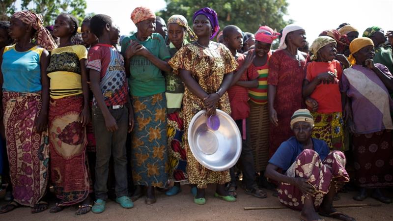 Women stand in line for food aid distribution in the village of Makunzi Wali, CAR