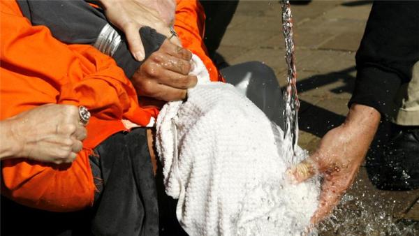 A demonstrator is held down during a simulation of waterboarding in Washington, DC in 2007