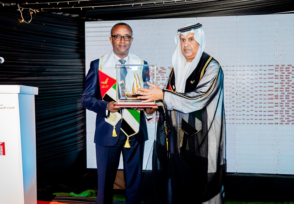Minister Biruta receiving a gift from UAE Ambassador to Rwanda. 