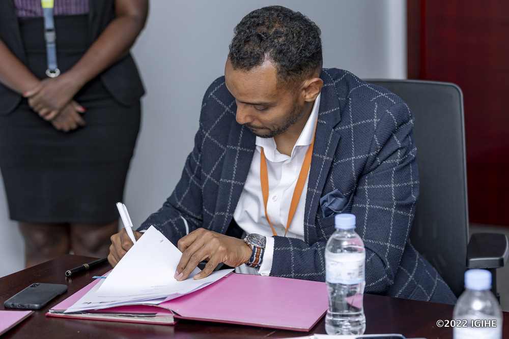 Hassan Adan Hassan, the Managing Director of ADHI signing the MoU. 