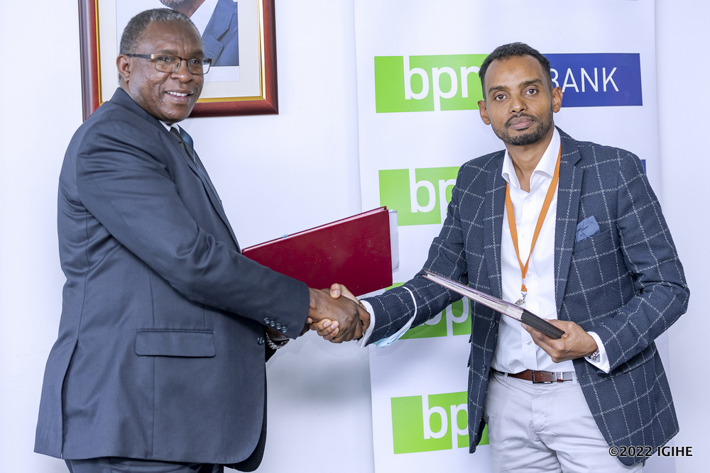 Hassan Adan Hassan, the Managing Director of ADHI shaking hands with the Managing Director of BPR after signing the MoU. 