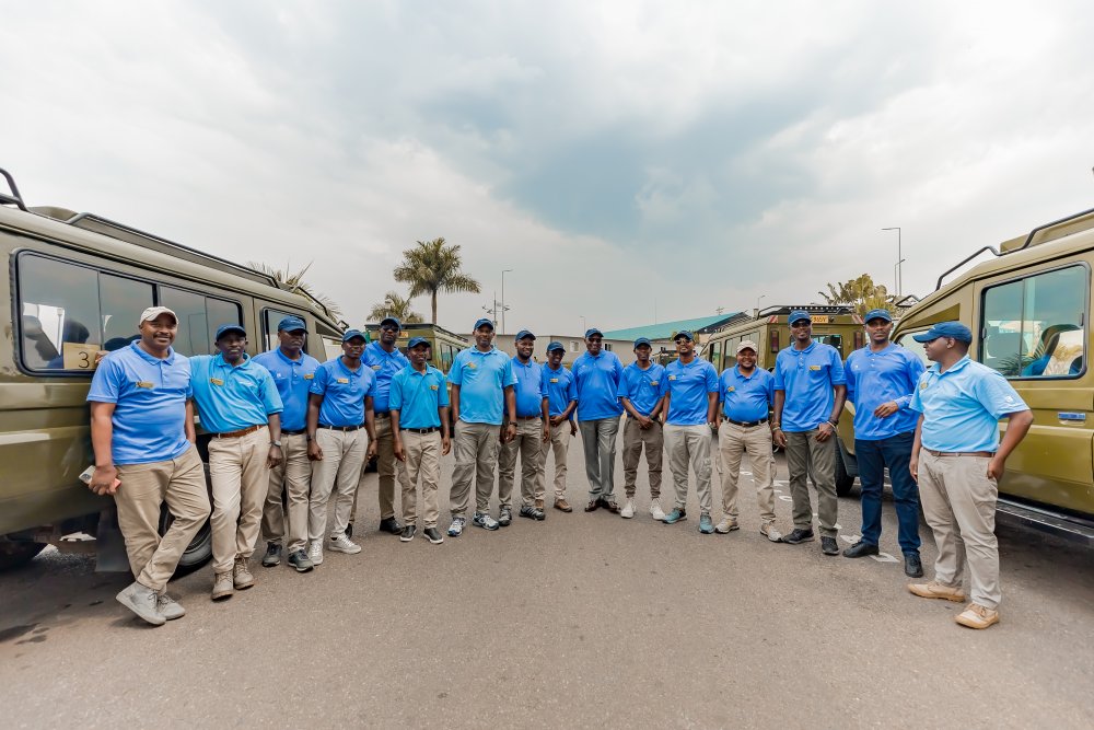 Paul Muvunyi, the Chairman and Director for Abercrombie & Kent with tour guides helping tourists visiting Rwanda. 