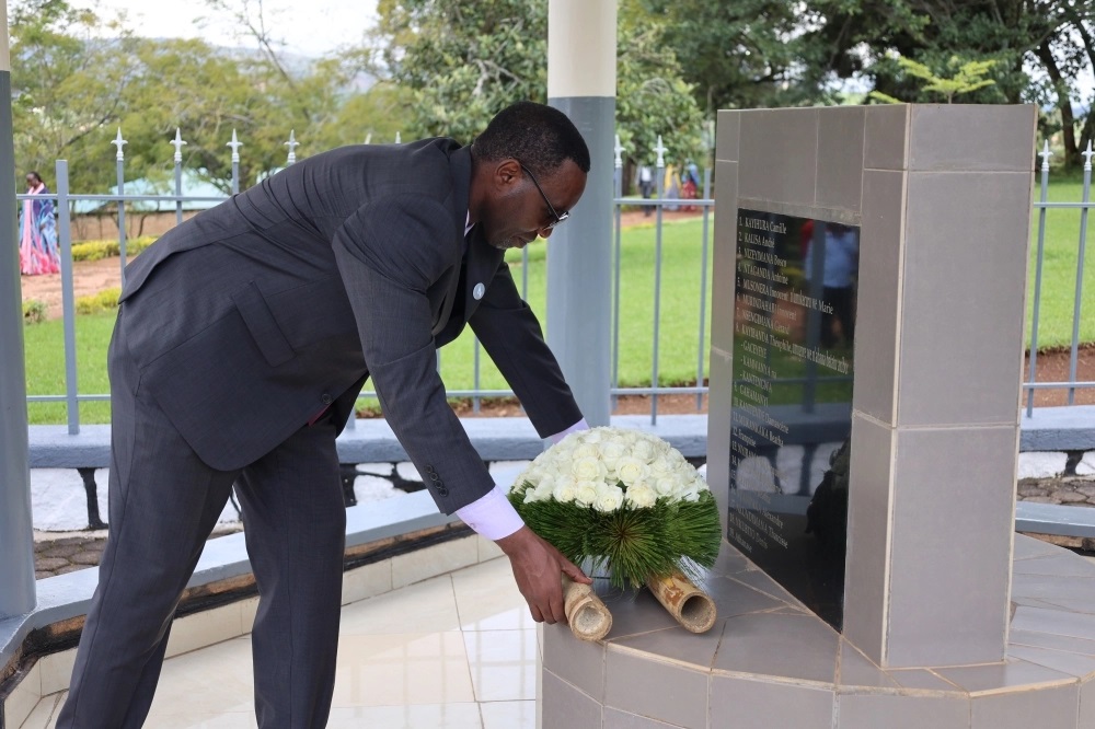 Dr. Sekomo laying a wreath at a memorial monument for former IRST employees killed during Genocide against the Tutsi.