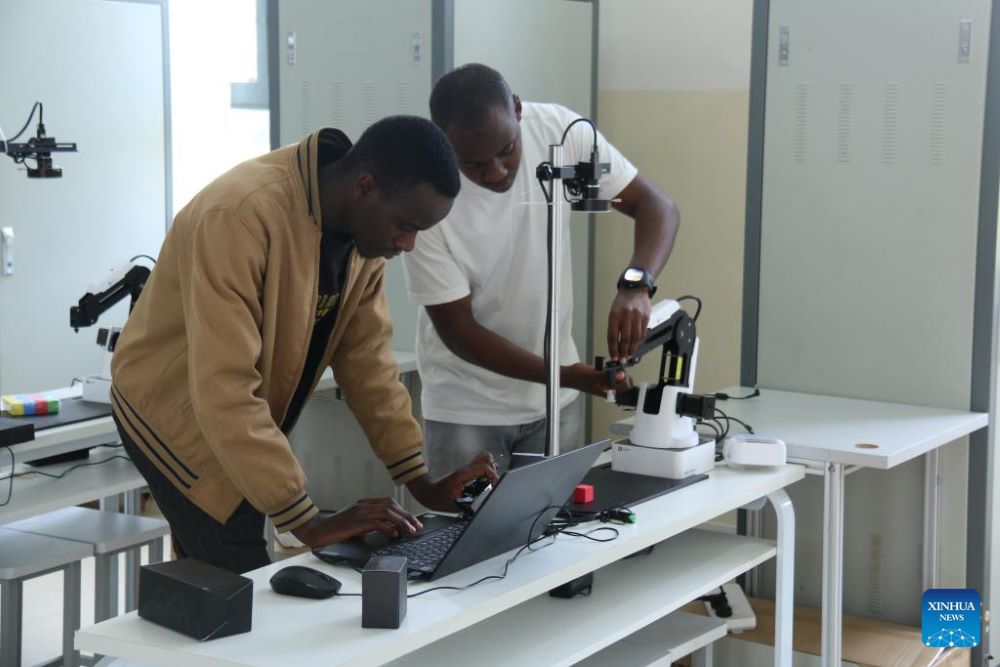 Local students operate devices in a laboratory of the Luban workshop at IPRC Musanze in Northern Province, Rwanda, Nov.18, 2023. (Photo by Huang Wanqing/Xinhua)