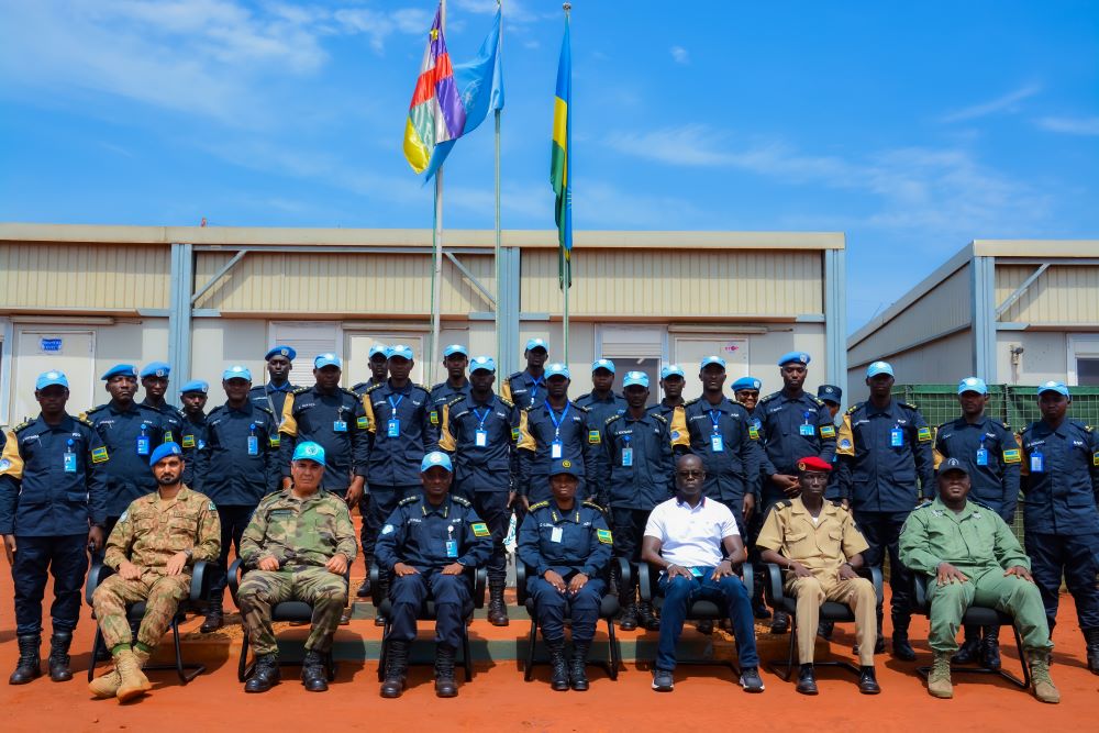 DCG Ujeneza poses for a group photo with Rwandan Police peacekeepers and the mission management team in CAR.