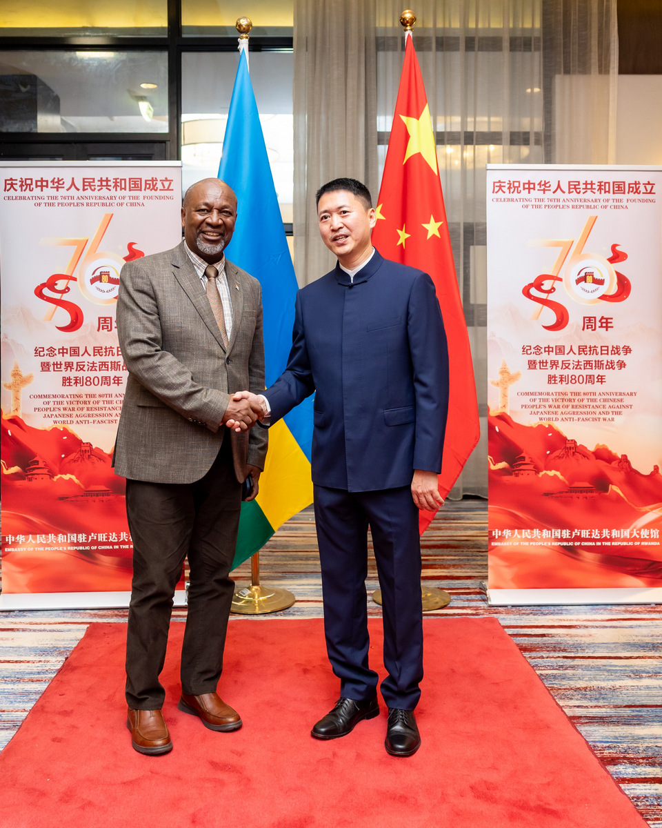 Chinese Ambassador to Rwanda welcoming Amb. Wellars Gasamagera, Secretary General of the Rwandan Patriotic Front at the event.