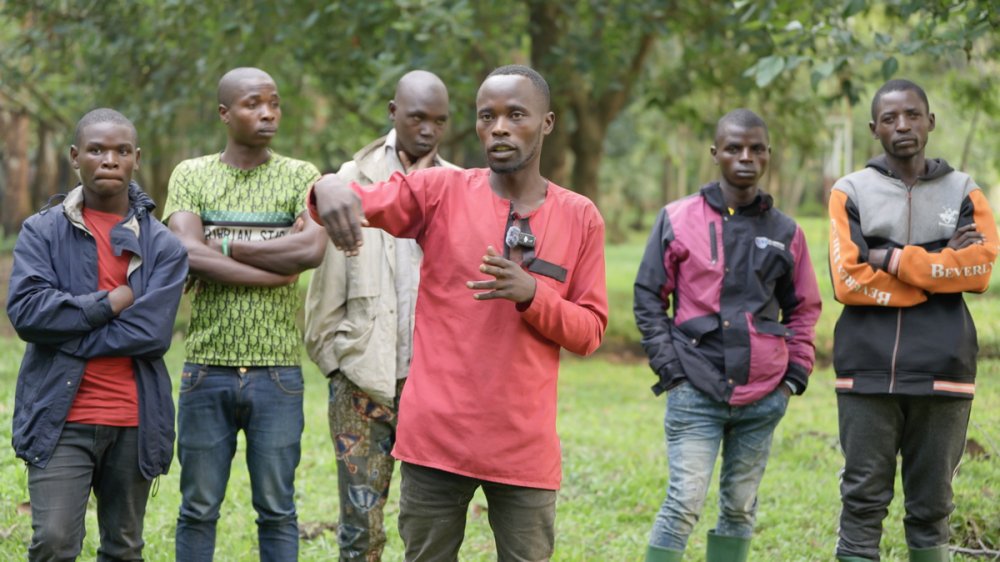Bizimana Jean Paul, standing in front, was part of Wazalendo. He revealed that they, along with FDLR, SADC forces, Burundian forces, FARDC, and other groups, were all fighting against M23.