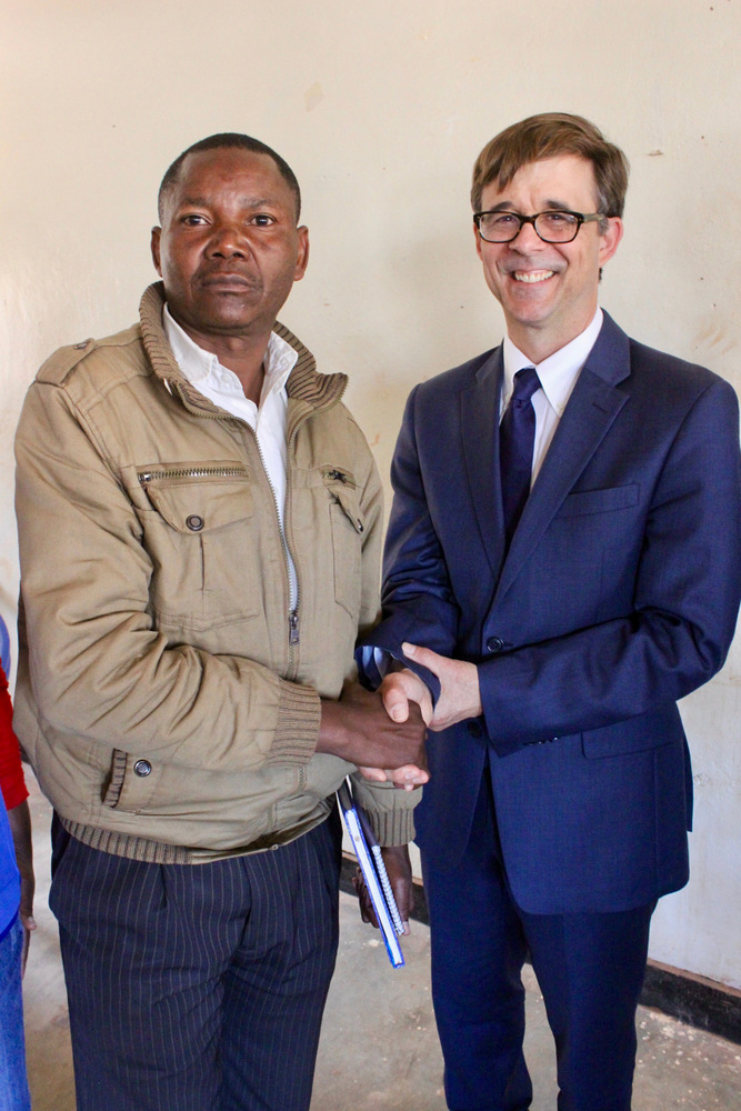 U.S. Ambassador Peter Vrooman with one of the refugee entrepreneurs 