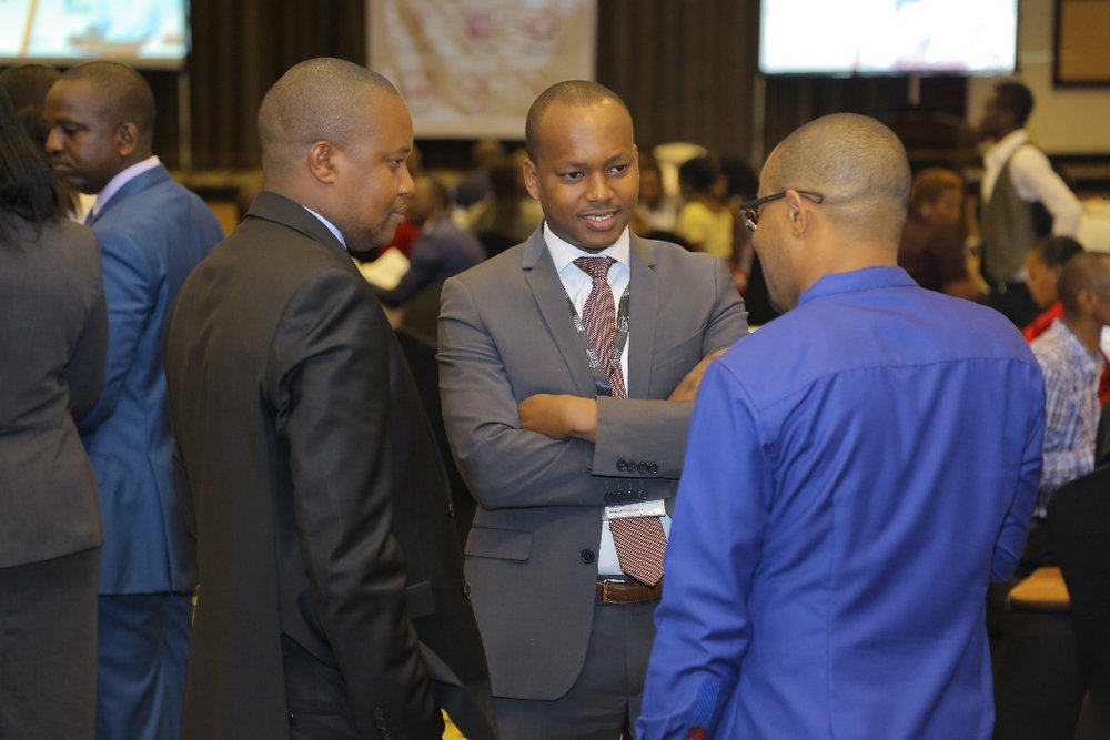The Head of Treasury department in Equity Bank Rwanda, Fernand Kamanzi and attendees engaged in a chat over the newly launched digital solutions