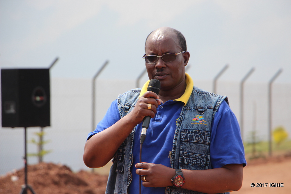 Rotary Club's Vice President in Rwanda, Masterjerb Birungi Paul explaining the vital importance of trees to the community