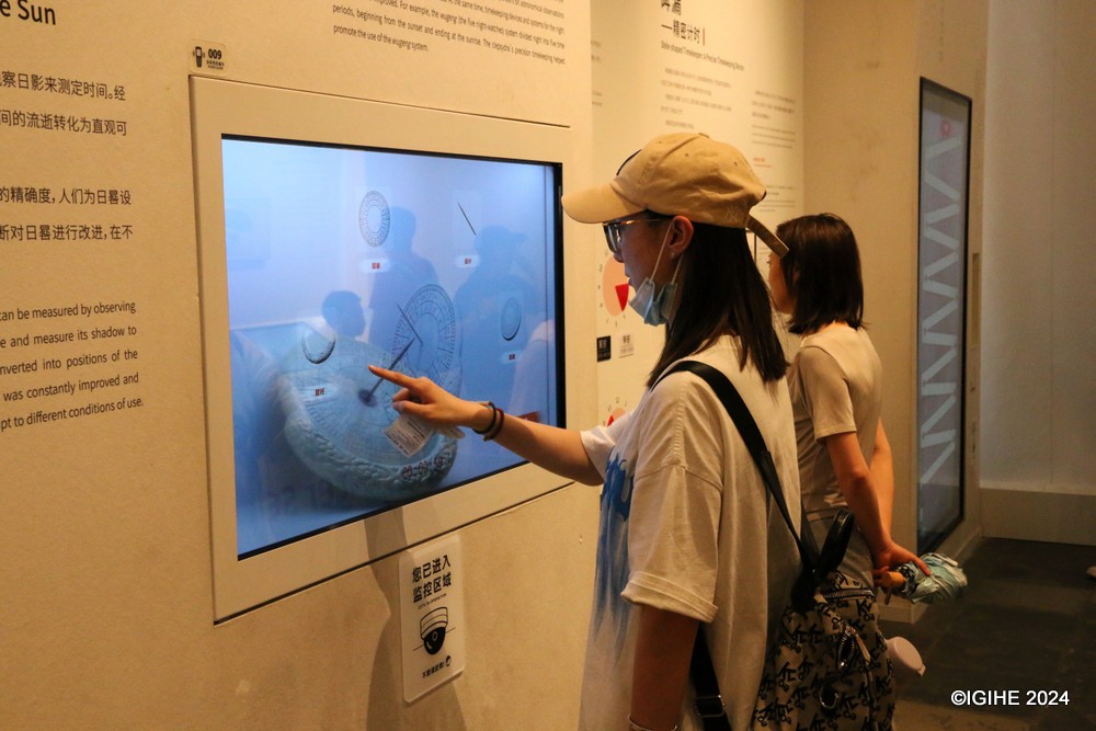 Visitors inside the exhibition hall of the Drum Tower exploring how ancient time keeping devices functioned.