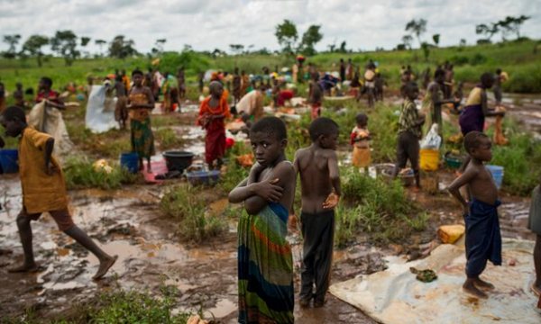Burundi refugees wash their clothes near a river on the edge of the Nyarugusu refugee camp in Tanzania. Photograph: Phil Moore