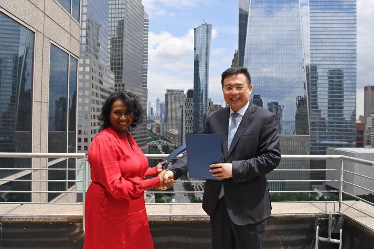 President of Xinhua News Agency Fu Hua and Daisy Veerasingham, president and CEO of the Associated Press (AP), exchange signed copy of cooperation agreement in New York, the United States, June 12, 2024. (Xinhua/Li Rui)