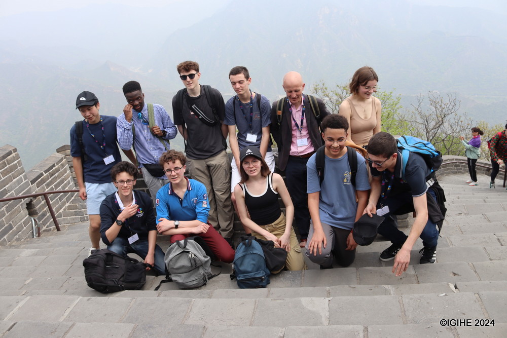 Climbers reaching the peak often celebrate by taking photographs as souvenirs.