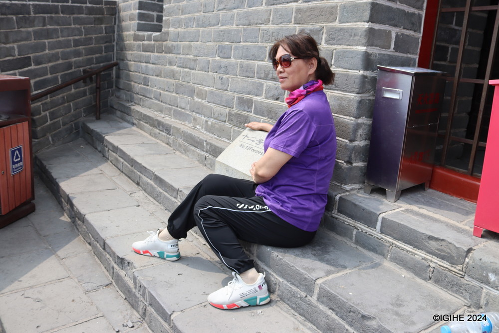 A visitor posing for a photo after reaching the top watchtower at Juyongguan Great Wall.
