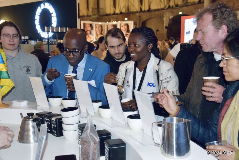 Amb. Nduhungirehe and other visitors of the festival tasting Rwanda's coffee. 