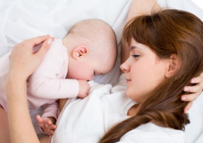 Mother breastfeeding her baby.