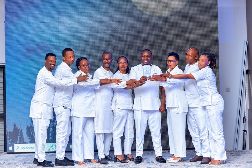 The officials and staff of Mega Global Market made a striking impression in white attire at the awards ceremony.