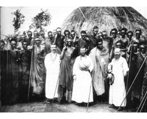 Belgian settlers and Rwandans together during the era of Belgian colonialism of Rwanda.