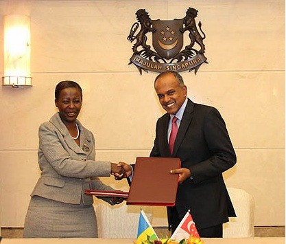 Minister for Foreign Affairs and Minister for Law K Shanmugam exchanging the Avoidance of Double Taxation Agreement he signed with his counterpart from the Republic of Rwanda, Minister of Foreign Affairs and Cooperation Louise Mushikiwabo.