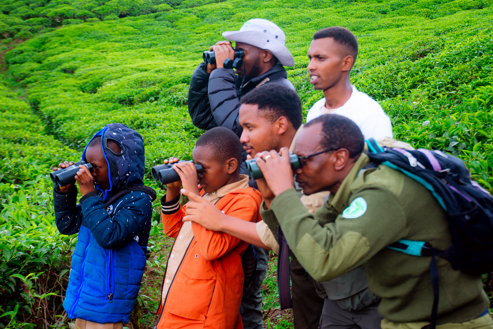 Through the establishment of birdwatching clubs, Claver Ntoyinkima mentors students, fostering a deeper understanding of and commitment to protecting Nyungwe’s ecosystem, which is home to over 300 bird species.