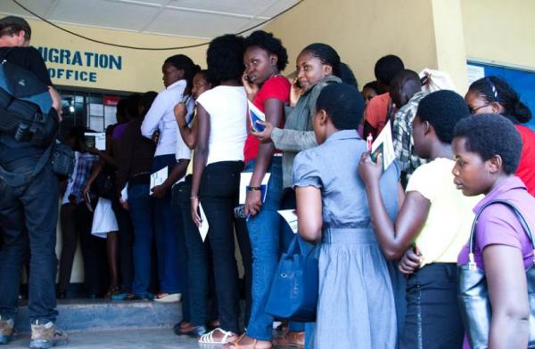 Rwandan students wait to be cleared at Rusumo border. The students are studying in Tanzania.