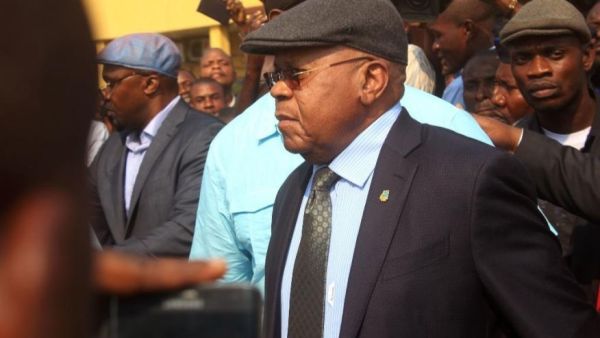 Congo opposition leader Etienne Tshisekedi, center, is greeted by supporters at the airport in Kinshasa, Congo, Wednesday, July 27, 2016. The leader of Congo's main opposition party returned to the country Wednesday after two years away for medical reasons and as tensions grow ahead of November presidential elections.