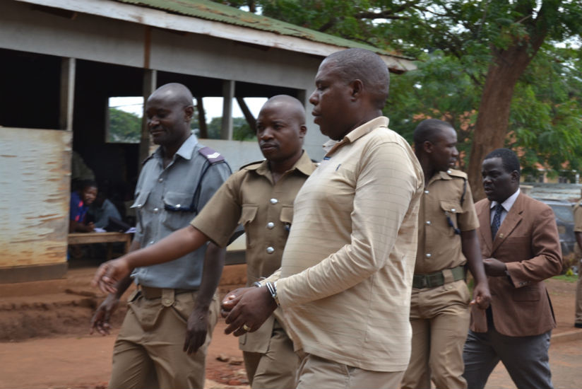Murekezi being led to a waiting police van. / Watipaso Mzungu