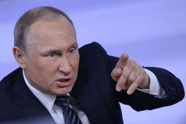 Russian President Vladimir Putin speaks during his annual press conference in Moscow on December 17, 2015. A massive leak of 11.5 million tax documents has exposed the secret offshore dealings of his aides, other world leaders and celebrities.