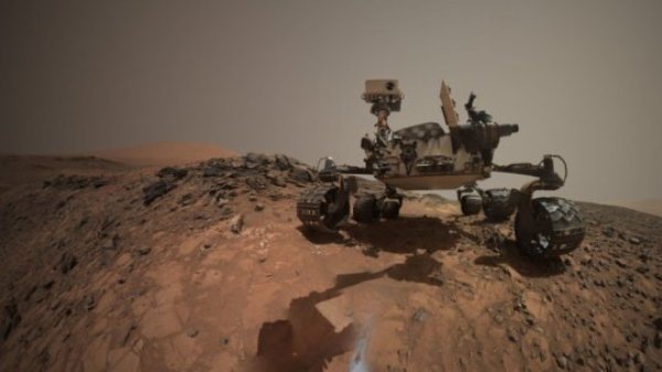 This low-angle self-portrait of NASA's Curiosity Mars rover shows the vehicle at the site from which it reached down to drill into a rock target called "Buckskin." Bright powder from that July 30, 2015, drilling is visible in the foreground.