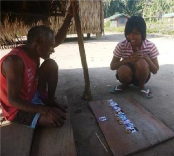 Agta camp member participating in study.